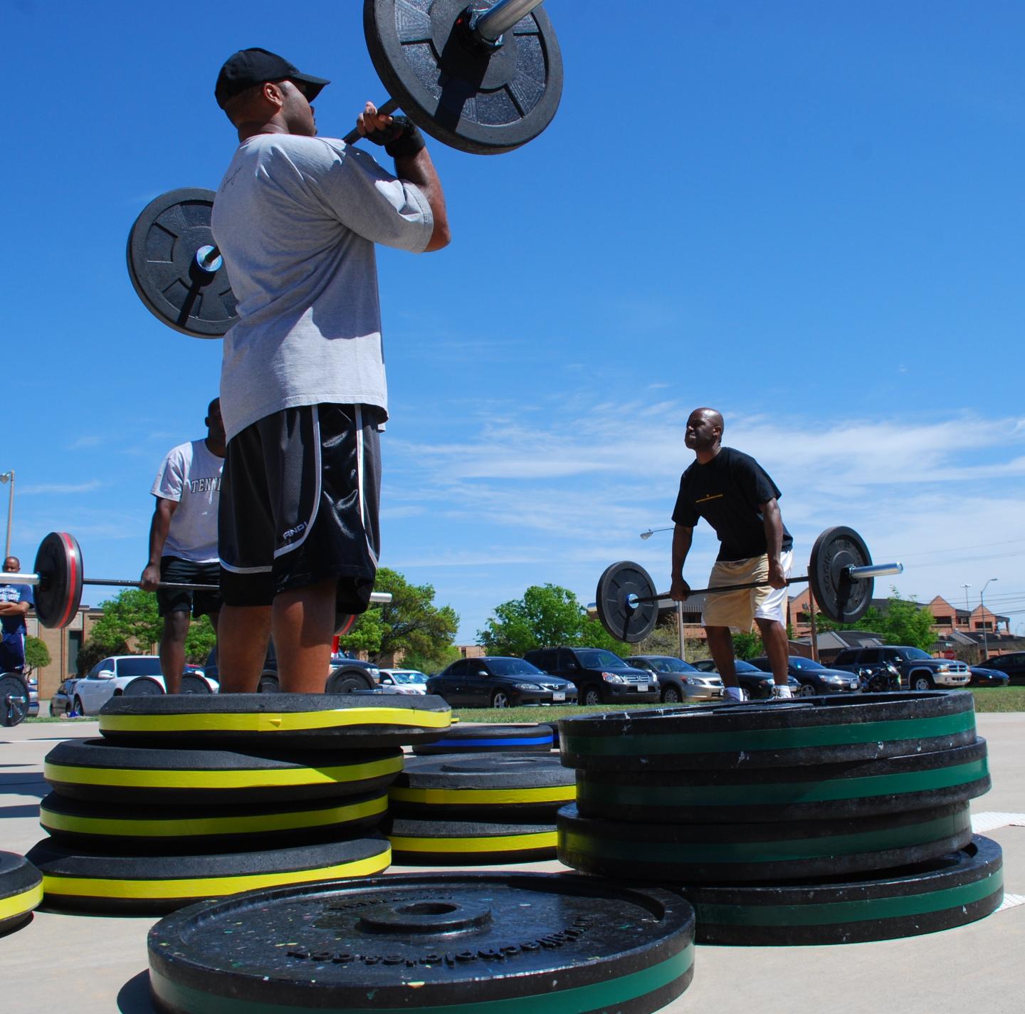 Men Lifting Weights