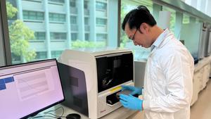 Assistant Professor Mervin Ang conducting sensor measurements using the fluorescence spectrometer.