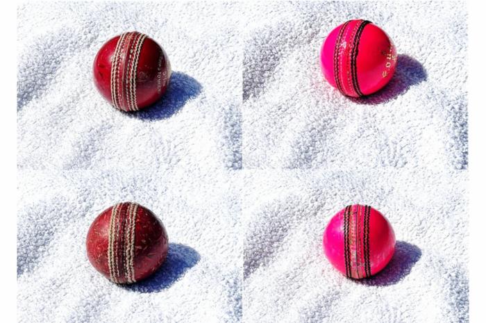 Pink versus red cricket ball contrasted against white background