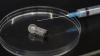 MucoJet Next to a Syringe