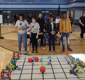 YO-STEM kids at a robotics competition