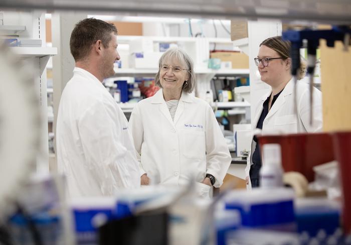 Virginia Byers Kraus, M.D., Ph.D., speaking with colleagues