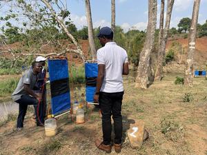 IMG_2499 - The research team in Malawi check one of the traps