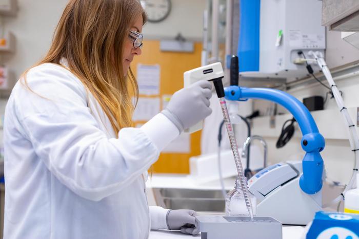 Research technologist preparing samples for genome sequencing