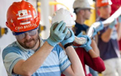 Chad Broyles Leading Technicians Carrying a Core