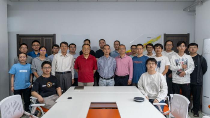 The picture features Dr. Qian Wang, Dr. Xinliang Yan, as members of Professor Meng Wang's research group from State Key Laboratory of Heavy Ion Science and Technology, Institute of Modern Physics, Chinese Academy of Sciences.