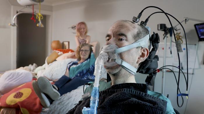 Trial participant Casey Harrell, pictured here in May 2026, has used the brain-computer interface at his home for two years.