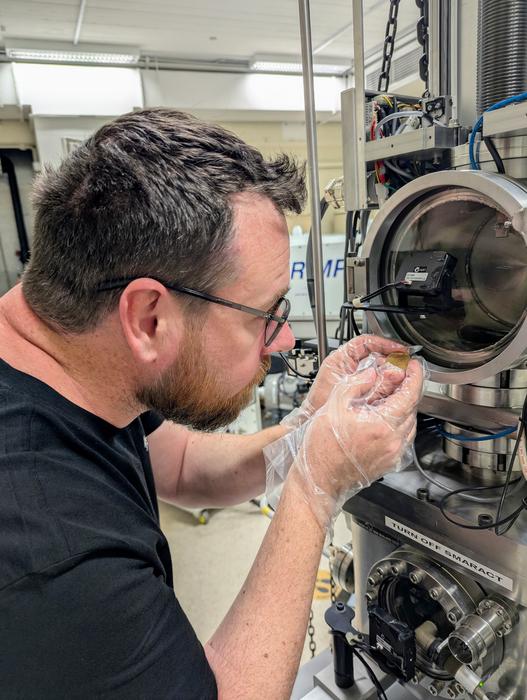 Professor Chris Kirkland using an ion microprobe to date zircon mineral grains, as part of the research (credit: C L Kirkland).