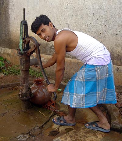 Man Pumping Water