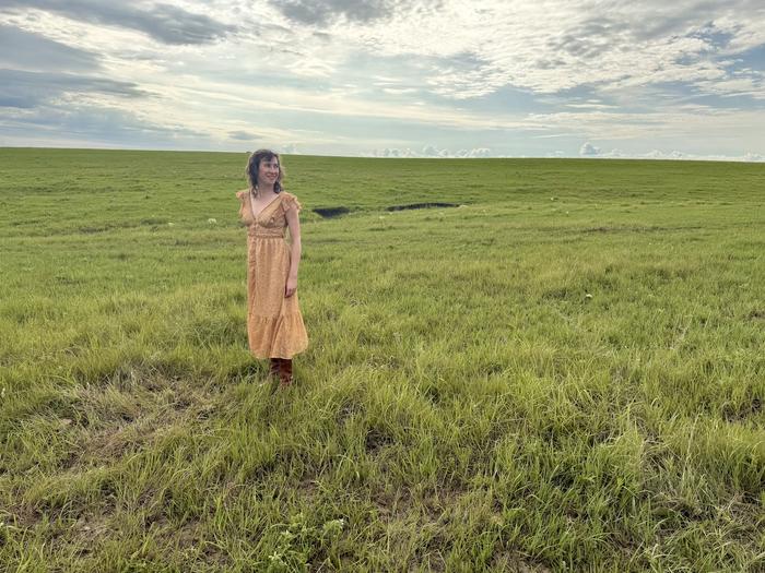 Poet in prairie landscape