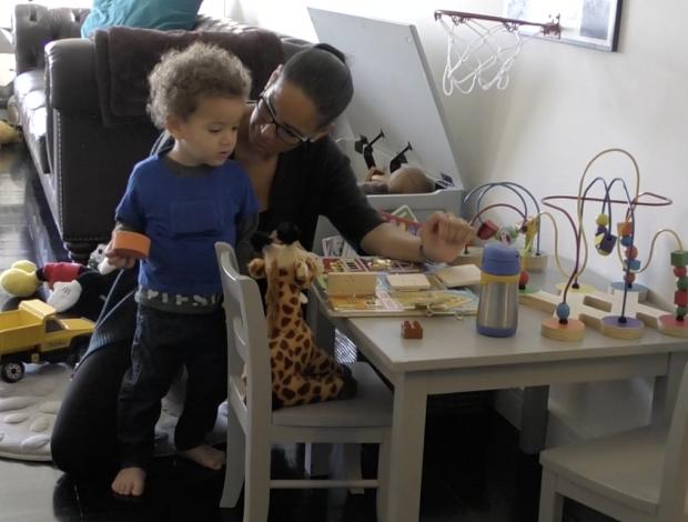 A Parent from the PLAY Project Playing with her Infant in their Home