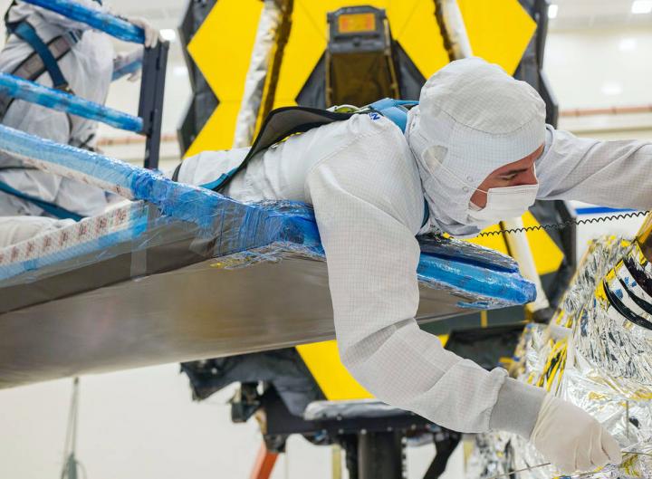 Technician Folds Webb Sunshield