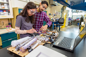students and disassembled device.jpg