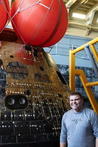 In front of the Orion Capsule