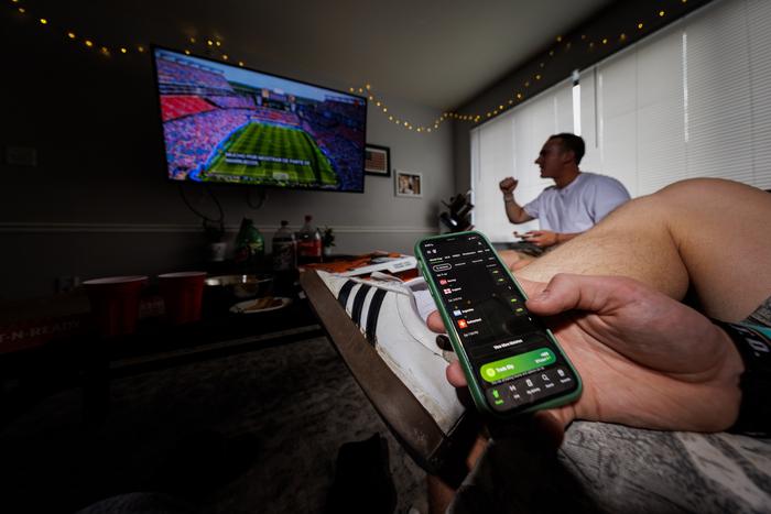 Photo illustration, sports betting app