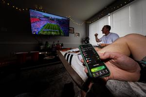 Photo illustration, sports betting app