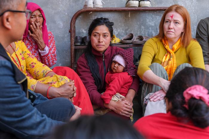Dr Jennifer Edwards in women's group in Nepal