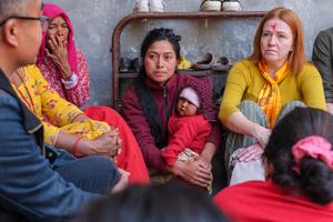 Dr Jennifer Edwards in women's group in Nepal