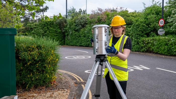 Dr Nat Easton setting up an air pollution monitoring station