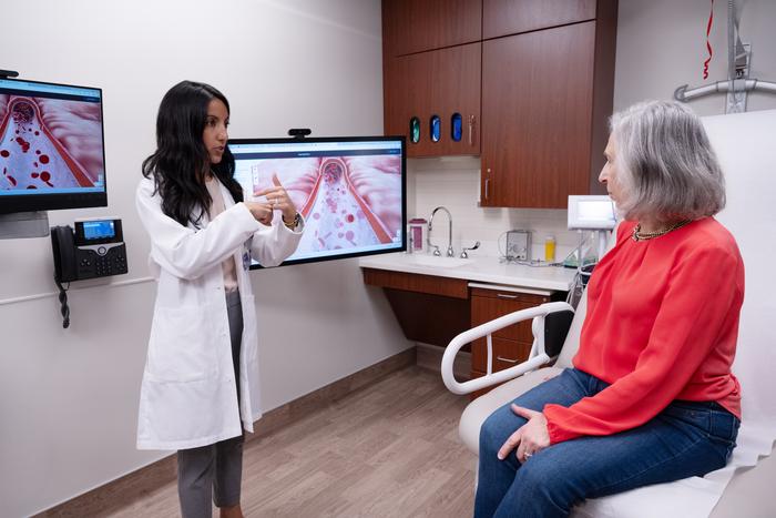 Study lead author Dr. Priya Freaney speaking to a patient