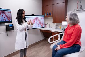 Study lead author Dr. Priya Freaney speaking to a patient