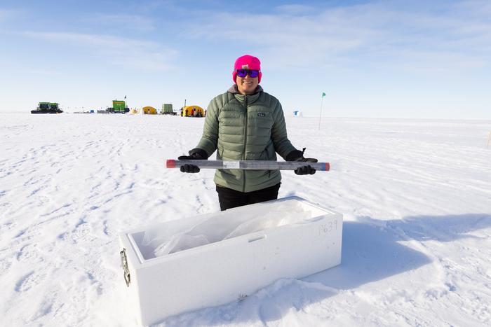 Co-chief scientist Molly Patterson holds length of packaged core