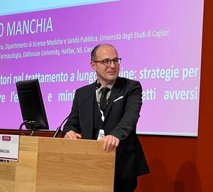Dr. Mirko Manchia at a recent national conference on neuropsychopharmacology in Rome.