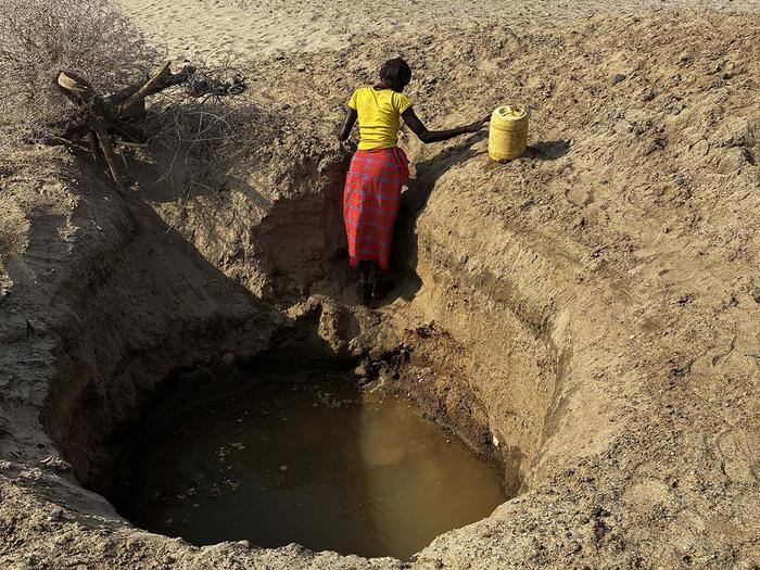 Woman at deep well