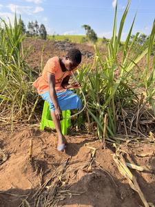 IMG_4605 - Fly trapper, Felia, sits by a river in Malawi