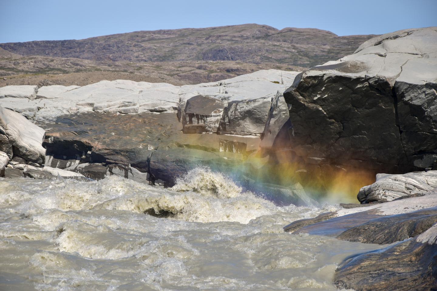 Milky meltwater river from Leverett Glacier Greenland