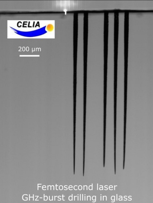 Top-down percussion drilling in glass by a femtosecond laser in GHz-burst mode