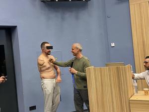 Dr. Cohen evaluating a Ukrainian Special Forces soldier with a right upper extremity amputation and suspected pain from a neuroma