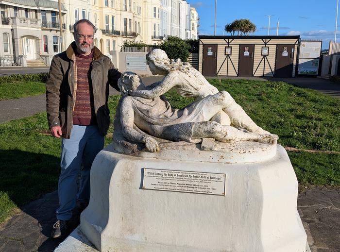 Prof Tom Licence with the statue of Harold and Edith West Marina Gardens, St Leonards-on-Sea, East Sussex