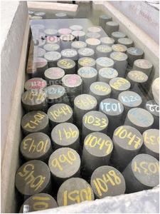 Concrete cylinders undergoing curing.