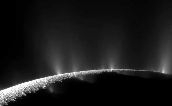 Plumes of water vapour and dust stream through cracks in the icy surface of the southern hemisphere of Enceladus.