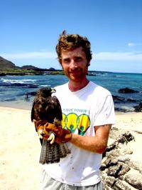 Noah Whiteman with a Gal&#225;pagos Hawk
