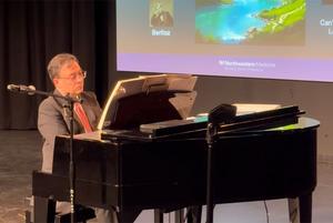 Dr. Borna Bonakdarpour plays piano at the Musical Museum