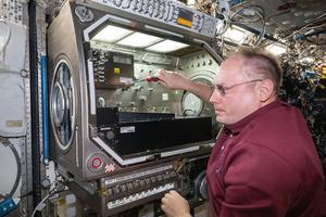 NASA Astronaut Mike Fincke sets up COLIS on board of the ISS