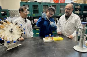 Doctoral student Meng Ji working in the lab with Stevens professors Xiaoguang Meng and Christos Christodoulatos.