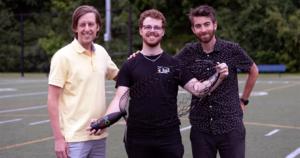 Frédérick Gosselin, Danick Lamoureux and David Mélançon with a prototype of their kirigami-patterned plastic parachute.