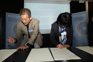 Researchers signing the declaration