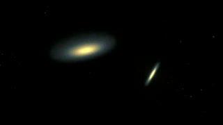 2 Spiral Galaxies Colliding