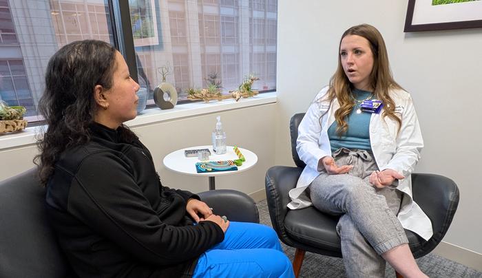 Study senior author Andrea Russell speaking to a nurse