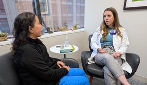 Study senior author Andrea Russell speaking to a nurse