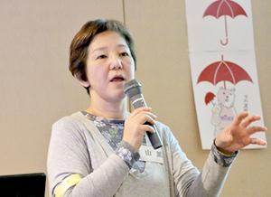 AOYAMA speaking at a symposium