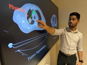 Study author Sagnik Sarkar pointing at the AI tool he built