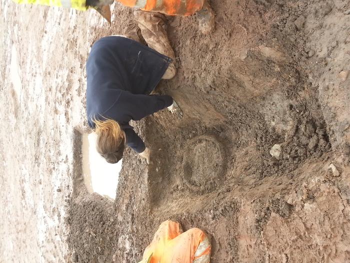 A cauldron being uncovered at Glenfield