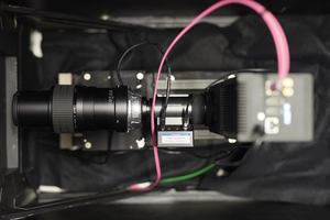 Camera with image intensifier and zoom lens