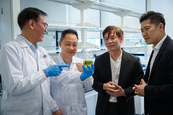 NTU Assoc Prof Andrew Tan, who is holding the new compound that reduces fat absorption in the gut (left)