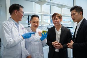 NTU Assoc Prof Andrew Tan, who is holding the new compound that reduces fat absorption in the gut (left)